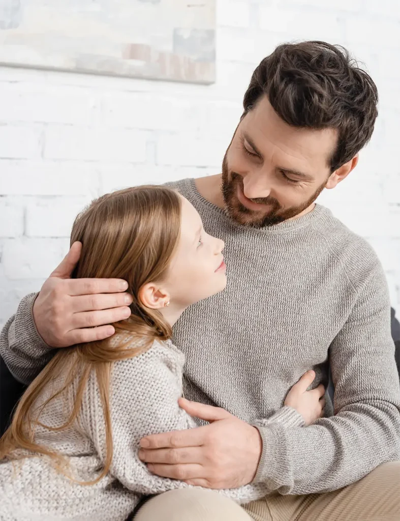 Father smiling at daughter