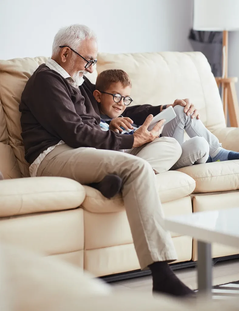 Grandpa reading to grandson
