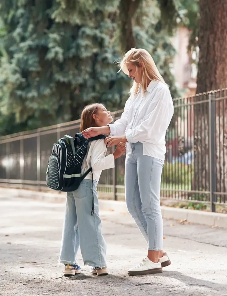 Mother seeing child off to school
