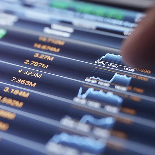 Close-up of a financial trading screen showing stock prices and investment data