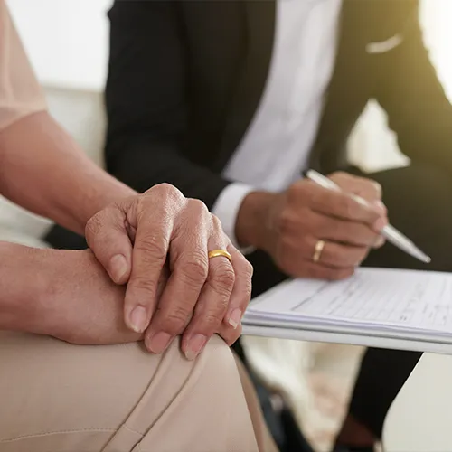 Lawyer explaining spousal support papers with client
