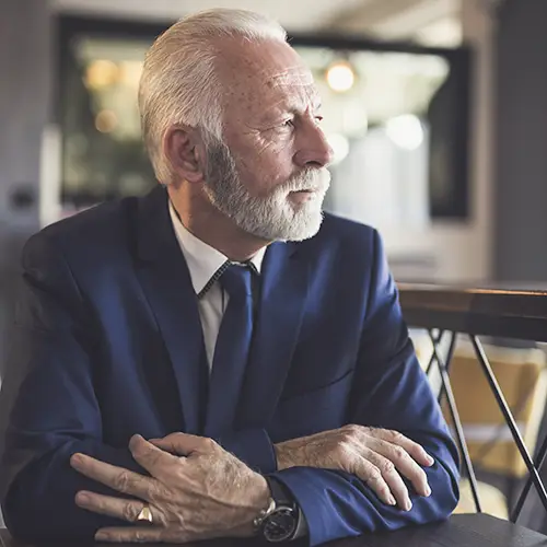 Senior man reflecting on retirement savings and RRSP division during divorce